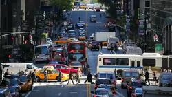 Traffic and pedestrians move through a busy intersection on 42nd Street in Midtown Manhattan. Stock Footage