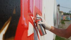 Graffiti artist spraying paint on wall (HD) Stock Footage