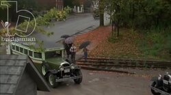 Cars and buses driving through town, 1930s - reenactment, clip 2 Stock Footage