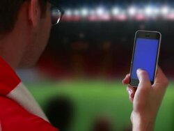 Smartphone at the game. Stock Footage