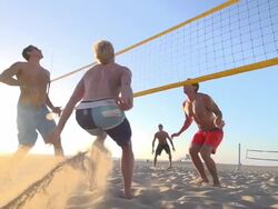 Men playing beach volleyball. - Slow Motion - filmed at 240 fps Stock Footage