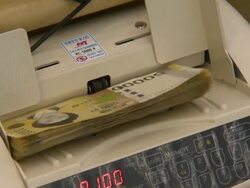 The automatic machine counting a fifty thousand won in notes Stock Footage