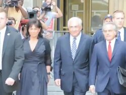 Anne Sinclair, Dominique Strauss-Kahn and lawyer Benjamin Brafman leave Manhattan Criminal Court after attending a status hearing on the sexual assault charges against Strauss-Kahn on August 23, 2011 in New York City. Stock Footage