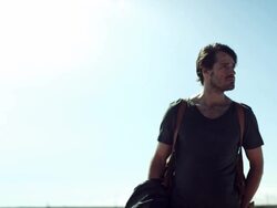 Backpacker walking through the desert Stock Footage