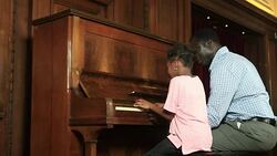 Father and Daughter play piano Stock Footage