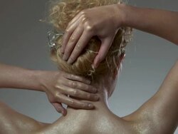 Rear view of woman covered in golden make up, tilt up Stock Footage