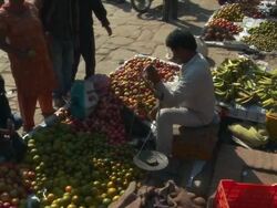 Woman buying apples in a market in Nepal. Stock Footage