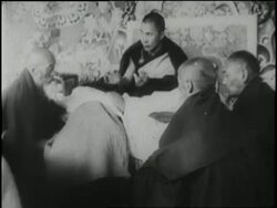 Monks gather around the Dalai Lama in Tibet. News Clip