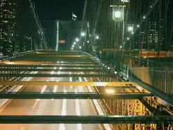 MS TL Night view of Brooklyn Bridge traffic lane with bike path / New York, New York, USA Stock Footage