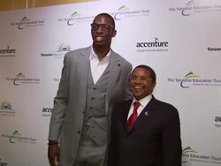 NBA player Hasheem Thabeet and His Excellency Jikaya Kikwete . (Footage by WireImage Video/GettyImages) Stock Footage