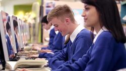 Students studying in school computer lab Stock Footage