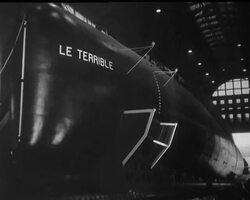 The second French Nuclear Submarine - Terrible - is launched at Cherbourg not long before the five gunboats mysteriously left this same port. News Clip