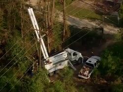 Sept. 11, 2005 aerial electricity repair team working with cherry picker after hurricane / Louisiana Stock Footage
