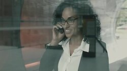 Businesswoman having friendly conversation on mobile phone Stock Footage