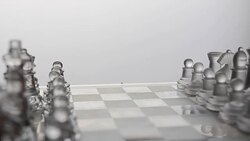 tilting and panning: glass chess competitor Stock Footage