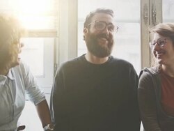 Young friends talking by a window Stock Footage