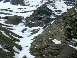 MS Slow tilt up, snowy Jebel Toubkal, highest peak in the high atlas mountains, Morocco, Africa Stock Footage