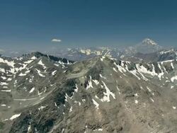 2010 AERIAL Group of gliders flying over rocky, snowcapped mountains / Santiago de Chile, Gran Santiago, Chile Stock Footage