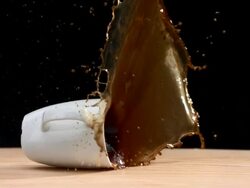 HD Super Slow-Mo: Splashing Coffee Cup Stock Footage