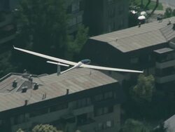 2010 AERIAL Glider flying over homes and buildings in the suburbs / Santiago de Chile, Gran Santiago, Chile Stock Footage