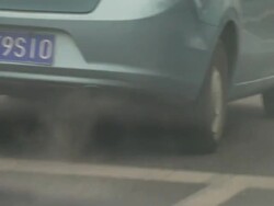 Commuters walking to work in centre of Beijing wearing smog masks. News Clip