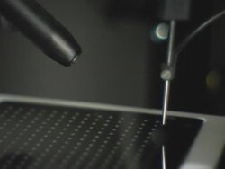 ECU, Machine places samples on steel plate Stock Footage