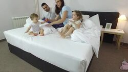 Family in bed Stock Footage