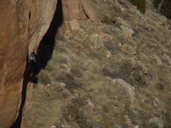 WS Looking down and across onto climber in she struggles to make move but takes fall and Rope catches her / Canon City / Shelf Road,CO,USA Stock Footage