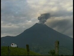 WA grey smoke and ash cloud billow from crater into white sky, Mount Tunguragua, Ecuador Stock Footage