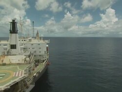 Landing on the helipad of an oil tanker from the air, Australia Stock Footage