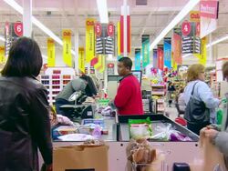 MS Shot of people in supermarket at cashier's desk packing things in bags / Minneapolis, Minnesota, United States Stock Footage