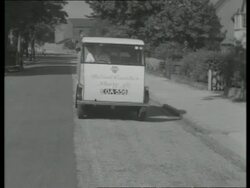 Electric delivery vehicles - milkman and milk float delivering milk, UK  1939 Stock Footage