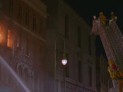 WS TU TD PAN Firemen spraying water on four story brick apartment building  / Unspecified Stock Footage