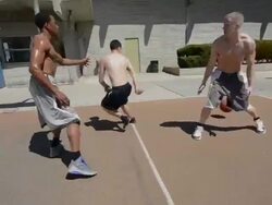 POV MS of basketball court and black and white players dribbling and passing the ball. Stock Footage