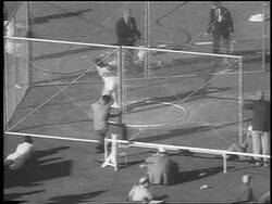 B/W 1962 high angle Harold Connolly throwing hammer throw / newsreel Stock Footage