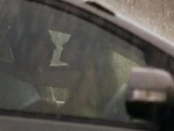 Young couple romancing in a car in rain season, Delhi, India Stock Footage