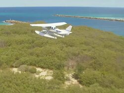 WS AERIAL ZI TS View of seaplane flying over / Kings Cliff, New South Wales, Australia Stock Footage