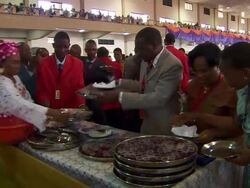 MS TS Shot of people serving drink to congregation in church / Lagos, Nigeria Stock Footage