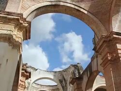 MS TD Shot of Oldest arch wall with tourists / Antigua, Guatemala Stock Footage