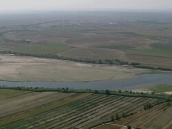 AERIAL WS PAN River Tagus wiggling through fields / Almourol, Santarem, Portugal Stock Footage