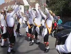 MS Shot of "Morrismen" dancing in street for Shakespeare birthday celebrations AUDIO / Stratford upon Avon, Warwickshire, United Kingdom Stock Footage