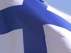ECU SLO MO Shot of Finland Flag Waving in Wind / Caen, Normandy, France Stock Footage