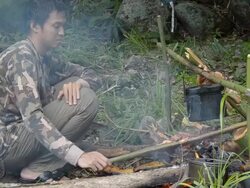 Forester preparing food Stock Footage