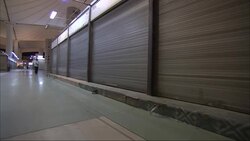 Storage units with overhead doors line a terminal in Saudi Arabia. Stock Footage