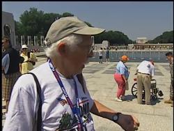 World War II veterans gather in Washington as part of a program to honor the nation's heroes, and reflect at national memorials. News Clip