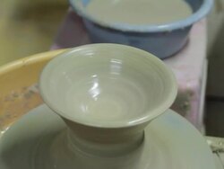 Shot of holding clay and making pottery shape with hands and pottery wheel Stock Footage