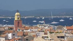 St Tropez with Church Bell tower and yachts in the distance.4K Stock Footage
