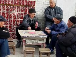 MS Shot of old people are playing bridge card game / Xian, China Stock Footage