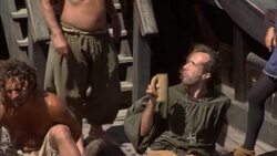 Sailors relax on the deck of a 15th century sailing ship. Stock Footage