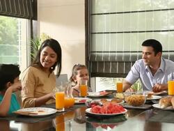 Family eating breakfast in a dining room  Stock Footage